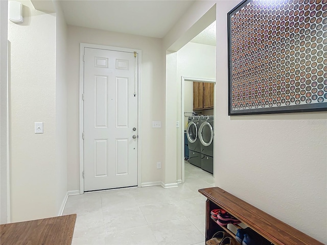 3361 Pegaso Ave, New Smyrna Beach, FL 32168 - laundry room featuring cabinet space, independent washer and dryer, and light tile patterned floors