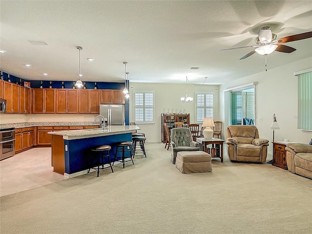 3361 Pegaso Ave, New Smyrna Beach, FL 32168 - living area featuring ceiling fan, a chandelier, light colored carpet, and recessed lighting