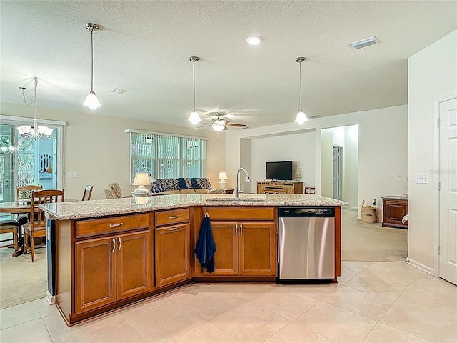 3361 Pegaso Ave, New Smyrna Beach, FL 32168 - kitchen with stainless steel dishwasher, brown cabinets, open floor plan, a chandelier, and a ceiling fan