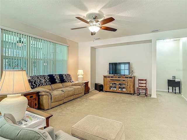 3361 Pegaso Ave, New Smyrna Beach, FL 32168 - carpeted living room with a ceiling fan and a textured ceiling