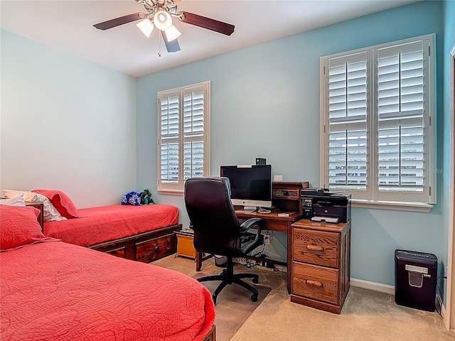 3361 Pegaso Ave, New Smyrna Beach, FL 32168 - carpeted bedroom with multiple windows, a desk, and a ceiling fan