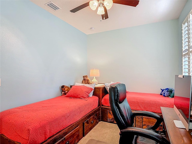 3361 Pegaso Ave, New Smyrna Beach, FL 32168 - carpeted bedroom with a ceiling fan and a desk