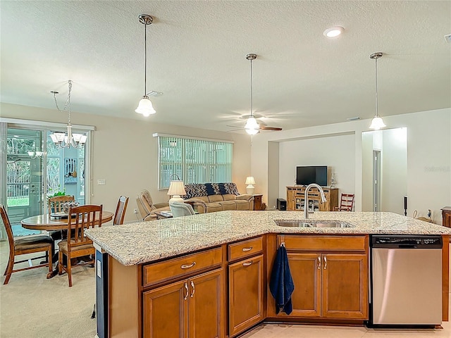 3361 Pegaso Ave, New Smyrna Beach, FL 32168 - kitchen with dishwasher, open floor plan, ceiling fan, a textured ceiling, and brown cabinetry