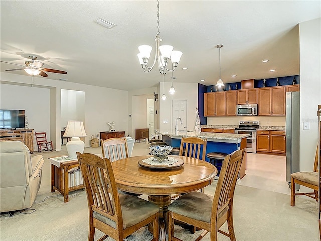 3361 Pegaso Ave, New Smyrna Beach, FL 32168 - dining space with a chandelier, light carpet, ceiling fan, and recessed lighting