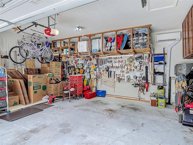 3361 Pegaso Ave, New Smyrna Beach, FL 32168 - garage featuring a wall mounted AC, a workshop area, and a garage door opener