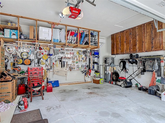 3361 Pegaso Ave, New Smyrna Beach, FL 32168 - garage featuring a workshop area, a garage door opener, and a wall unit AC