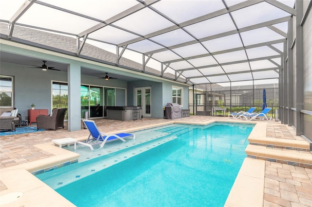2931 Bella Flore Ter, New Smyrna Beach, FL 32168 - swimming pool with ceiling fan, a hot tub, a patio area, and a lanai