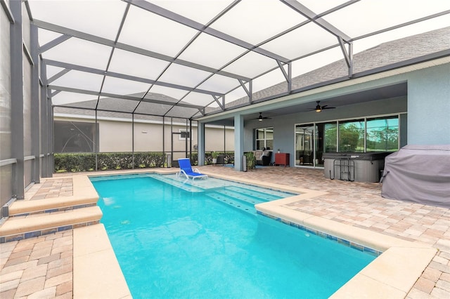 2931 Bella Flore Ter, New Smyrna Beach, FL 32168 - outdoor pool with ceiling fan, a patio, a hot tub, and a lanai