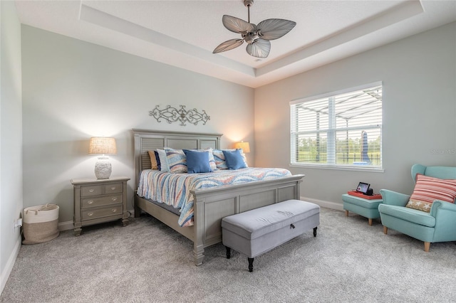 2931 Bella Flore Ter, New Smyrna Beach, FL 32168 - carpeted bedroom with a tray ceiling and a ceiling fan