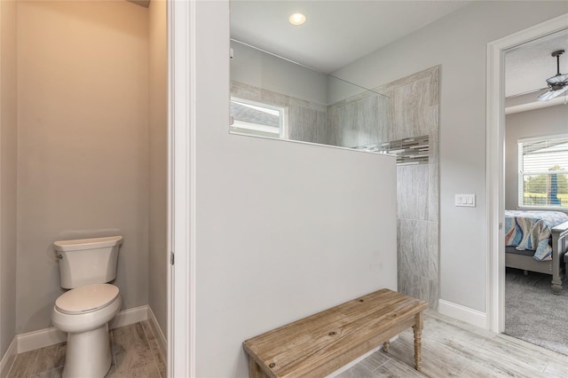 2931 Bella Flore Ter, New Smyrna Beach, FL 32168 - ensuite bathroom featuring a walk in shower, wood finished floors, and ceiling fan