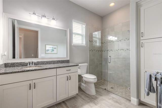 2931 Bella Flore Ter, New Smyrna Beach, FL 32168 - full bath featuring vanity, a shower stall, wood finished floors, and recessed lighting