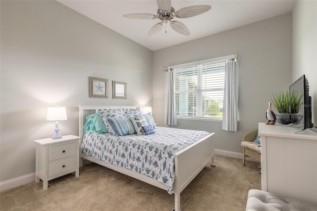 2931 Bella Flore Ter, New Smyrna Beach, FL 32168 - bedroom with light carpet and a ceiling fan
