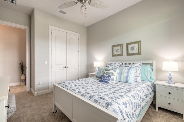 2931 Bella Flore Ter, New Smyrna Beach, FL 32168 - bedroom with light colored carpet, a closet, and a ceiling fan