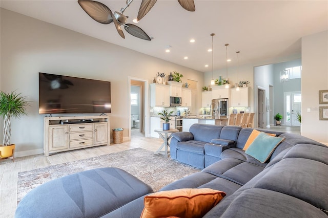 2931 Bella Flore Ter, New Smyrna Beach, FL 32168 - living room with a ceiling fan, recessed lighting, and a towering ceiling