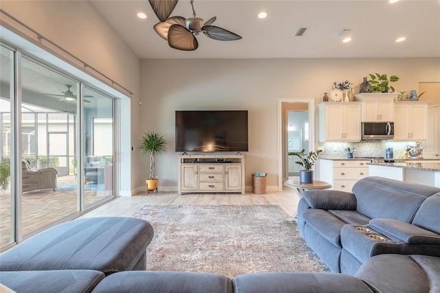 2931 Bella Flore Ter, New Smyrna Beach, FL 32168 - living room featuring ceiling fan, light wood-style floors, and recessed lighting