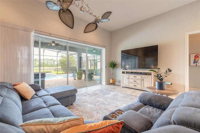 2931 Bella Flore Ter, New Smyrna Beach, FL 32168 - living area with ceiling fan, high vaulted ceiling, and wood finished floors