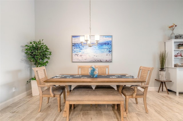 2931 Bella Flore Ter, New Smyrna Beach, FL 32168 - dining area with a chandelier and light wood finished floors