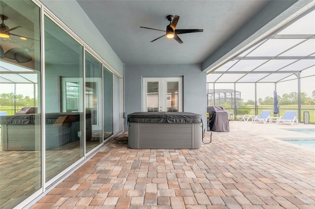 2931 Bella Flore Ter, New Smyrna Beach, FL 32168 - view of patio / terrace with a hot tub, ceiling fan, area for grilling, and glass enclosure