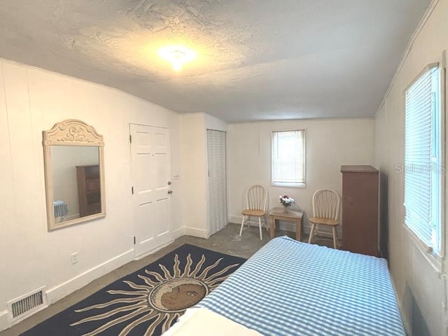 322 Taylor Ave, Daytona Beach, FL 32114 - bedroom with a textured ceiling and vaulted ceiling