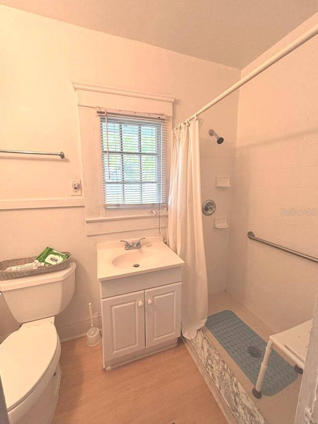 322 Taylor Ave, Daytona Beach, FL 32114 - full bath with tiled shower, wood finished floors, and vanity