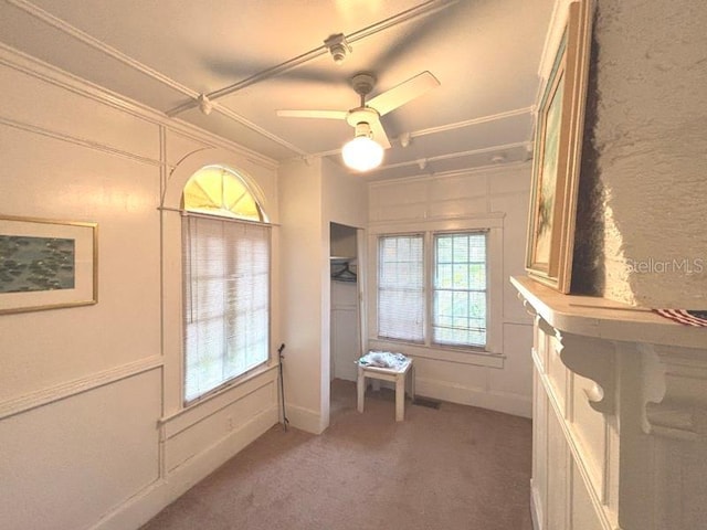 322 Taylor Ave, Daytona Beach, FL 32114 - doorway to outside with light carpet, healthy amount of natural light, and a ceiling fan