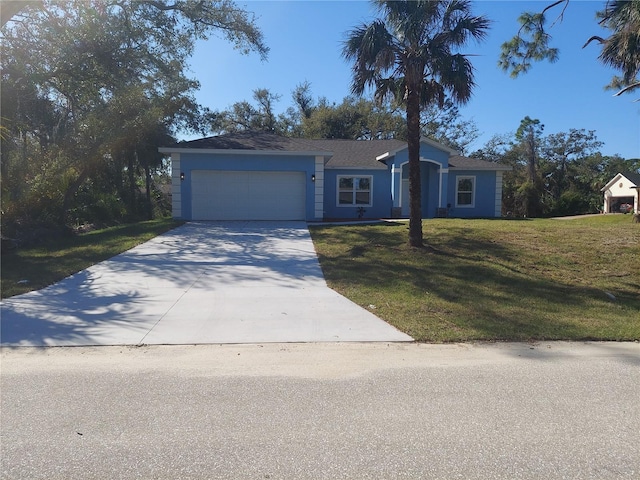 ranch-style house featuring a garage, driveway, and a front lawn