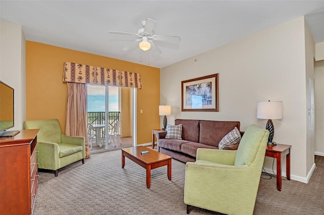 living room featuring ceiling fan and carpet