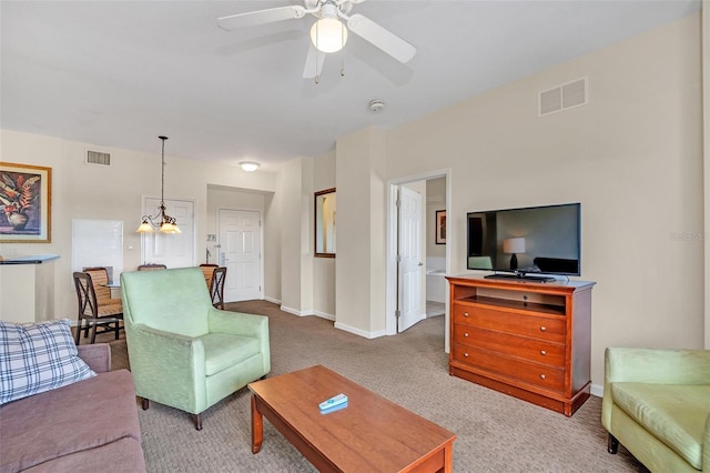 carpeted living room featuring ceiling fan