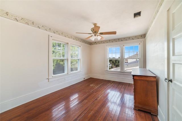 spare room featuring dark hardwood / wood-style floors and ceiling fan