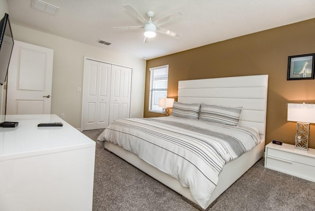 bedroom featuring a closet, ceiling fan, and dark colored carpet