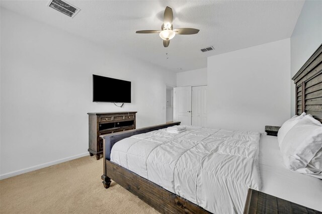 carpeted bedroom featuring ceiling fan