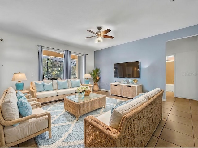 tiled living room with ceiling fan