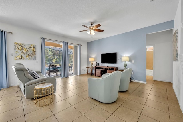 tiled living room featuring ceiling fan and a textured ceiling