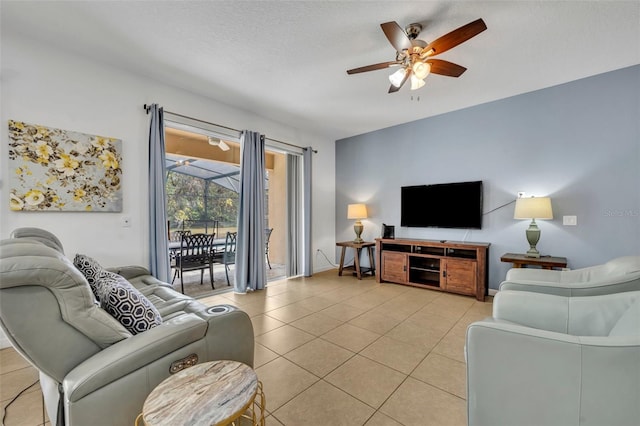 tiled living room featuring ceiling fan and a textured ceiling