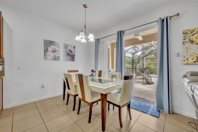 dining room with an inviting chandelier and light tile patterned floors