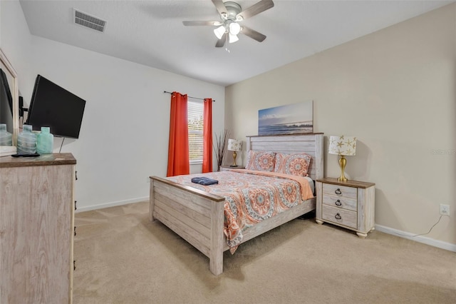 bedroom featuring ceiling fan and light colored carpet