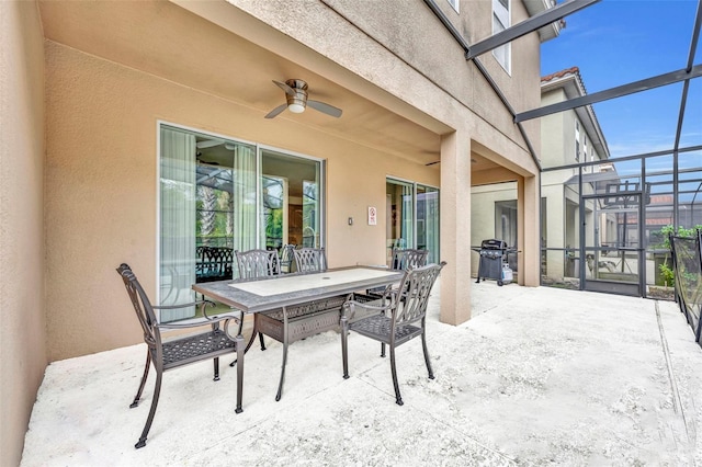 view of patio / terrace with ceiling fan and a grill