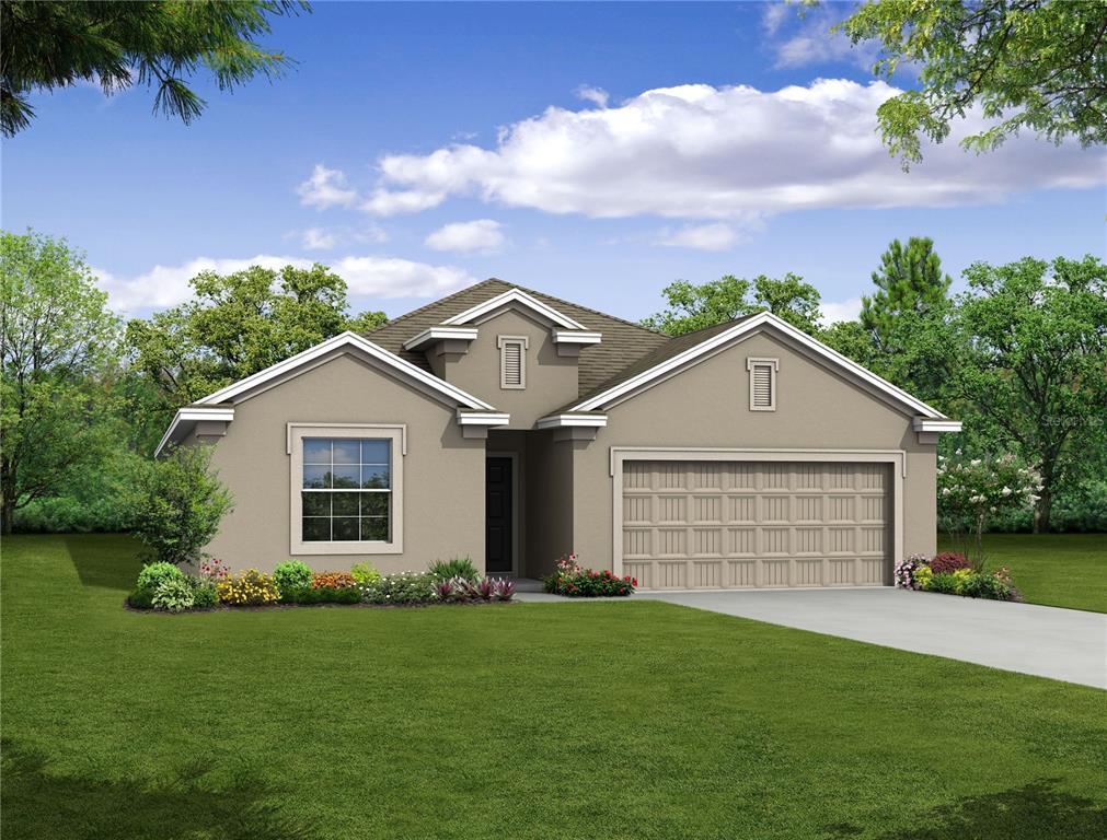 view of front of property with a front lawn and a garage