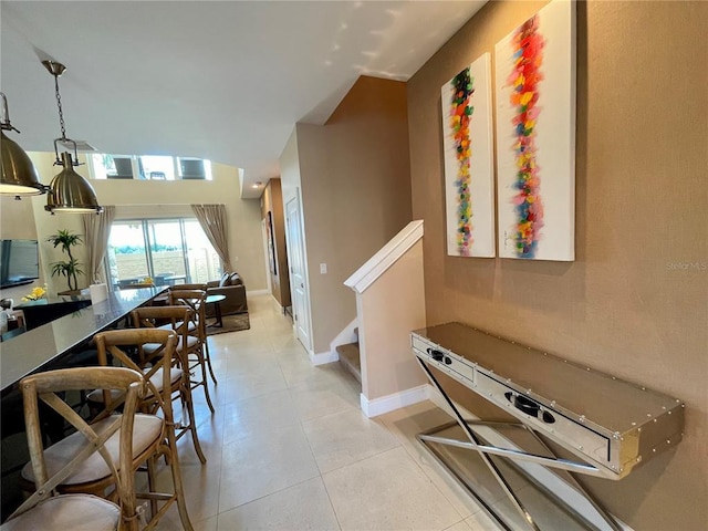 dining area featuring light tile floors