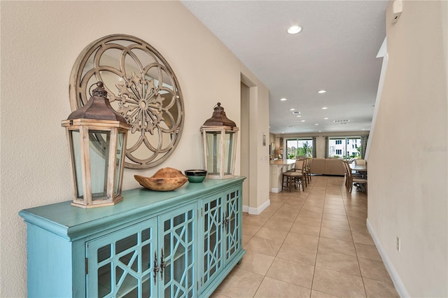 hallway with light tile flooring