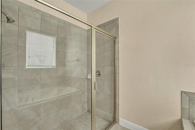 bathroom featuring a shower with door