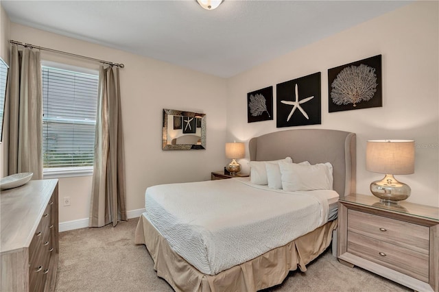 bedroom with light colored carpet