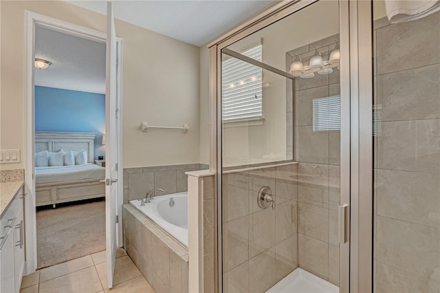 bathroom with vanity, plus walk in shower, and tile flooring