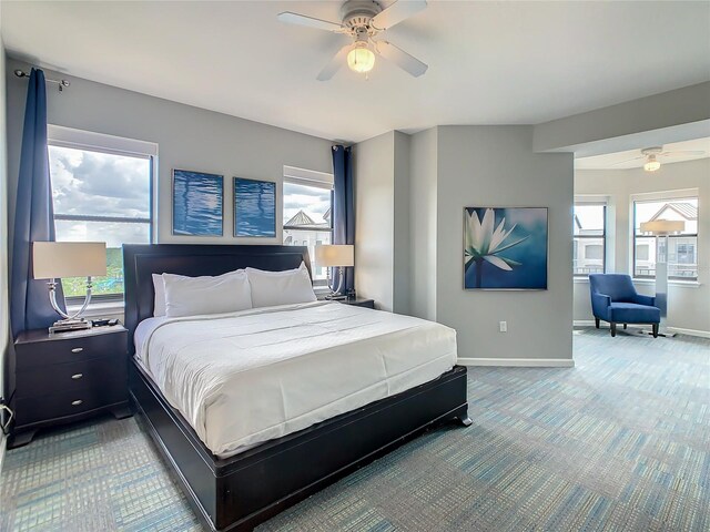 bedroom with ceiling fan and carpet floors