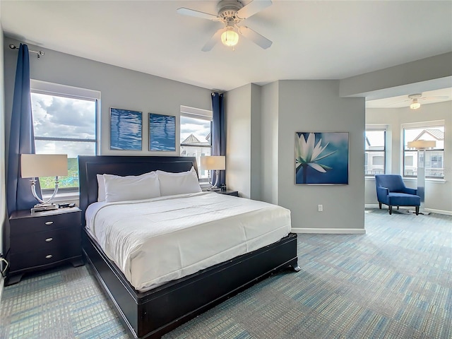 carpeted bedroom featuring ceiling fan