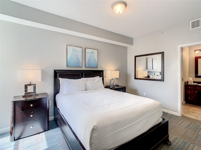 tiled bedroom with ensuite bath