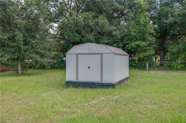 view of shed / structure featuring a yard