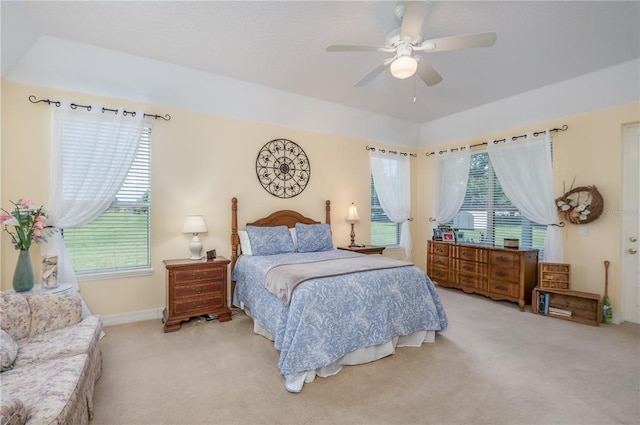 bedroom featuring light colored carpet and ceiling fan