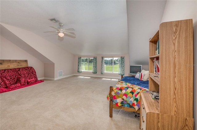 carpeted bedroom featuring ceiling fan and lofted ceiling