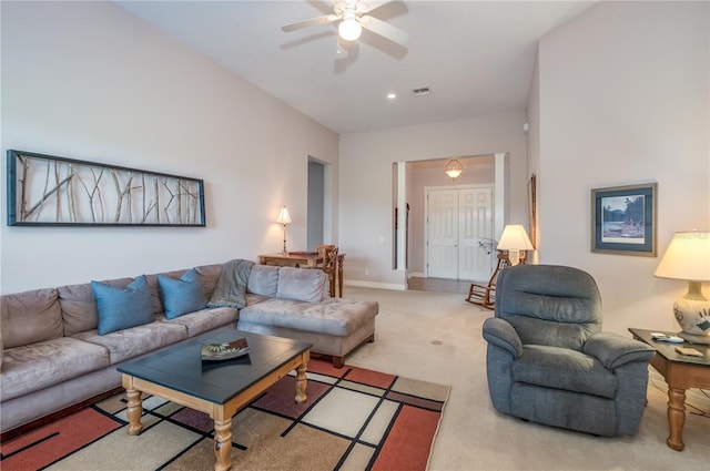 living room featuring light colored carpet and ceiling fan